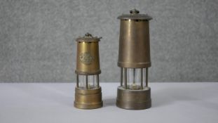 Two brass Welsh miners lanterns. One with plaque with dragon and Cymru. H.28 Diam.9cm (largest)