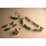 A gilded metal Chinese spinach jade necklace, bracelet and earring set along with a purple paste and