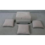 A contemporary upholstered footstool with matching cushions. H.33 W.64 D.50 cm (largest)