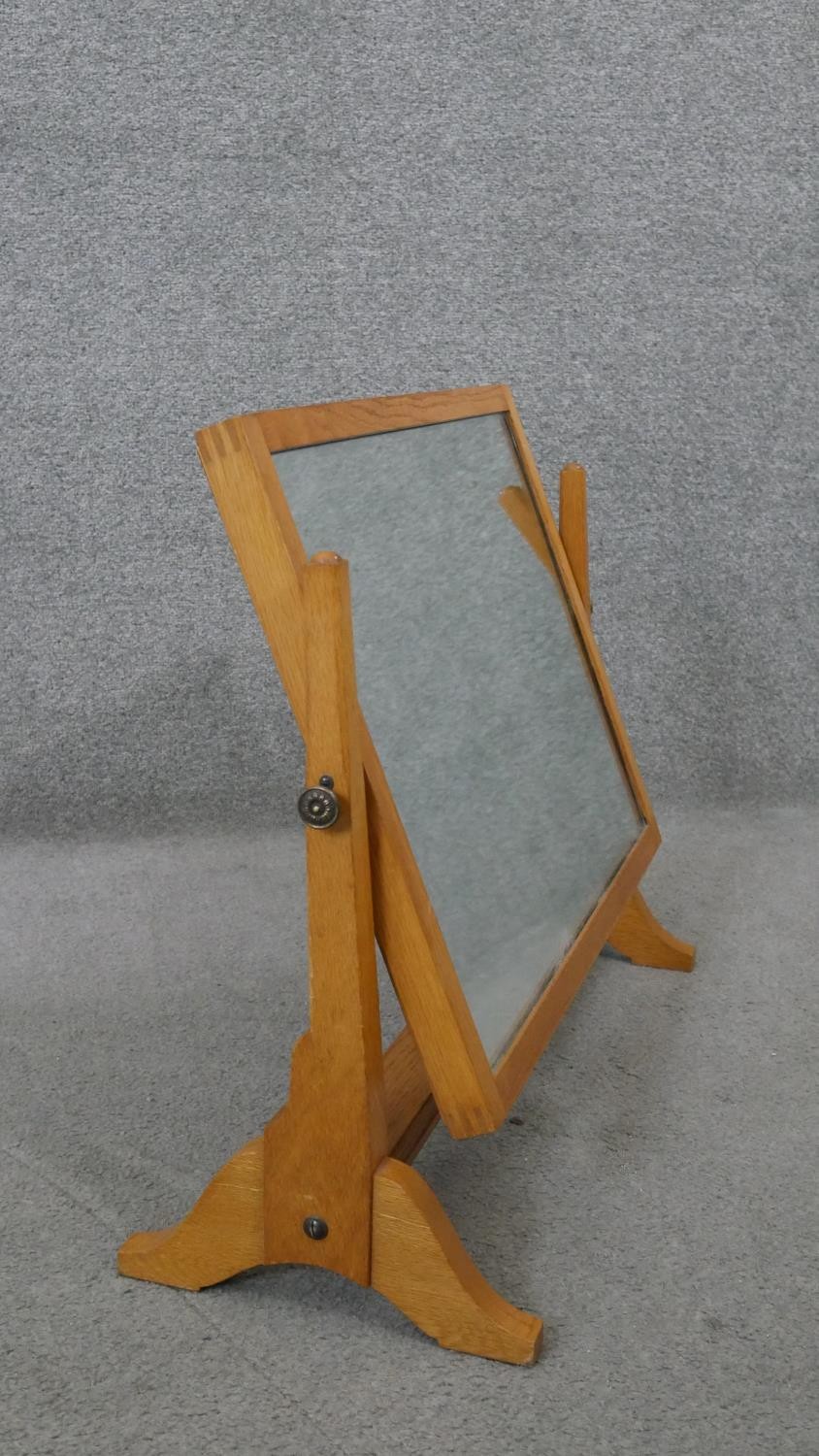 A Herbert Gibbs oak swing mirror, stamped to underside. H.52 W.64 D.25CM - Image 3 of 7