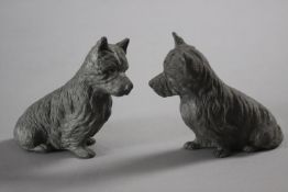 A pair of hollow cast lead seated Scottie dogs. H.10 W.10. D.5cm.
