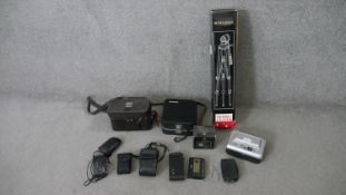 A collection of vintage cameras and camera equipment. Including a vintage Sekonic Micro-eye movie