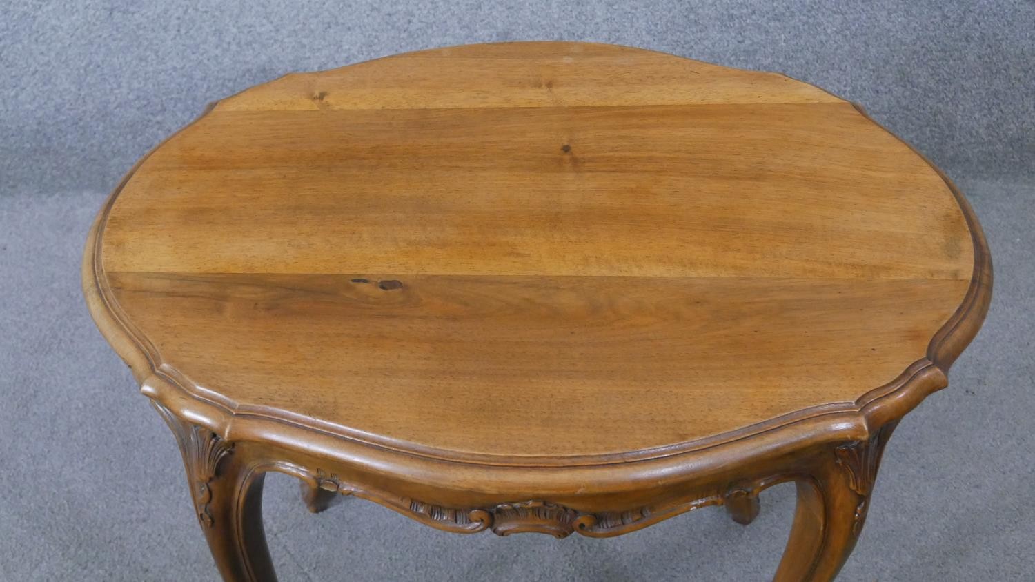 A Continental style walnut centre table on carved cabriole supports. H.55 W.72 D.54CM - Image 3 of 5