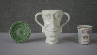 A collection of royal commemorative items. Including a ceramic green glaze Wade England coronation