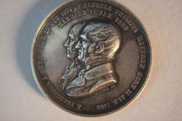 A 19th century 50th wedding day celebration silver medal. Celebrating the marriage of J. Frederick