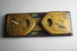 A Victorian hand painted and gilded papier-mâché book slide. Each end decorated with an oriental
