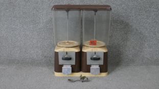 A double vintage sweet dispenser with spoon on chain. (No key)A H.40 W.33 D.16cm