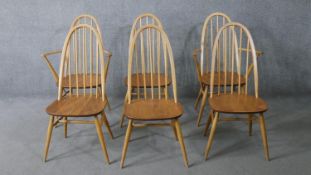 A set of six mid century Ercol Quaker dining chairs with blonde beech splats and supports and elm