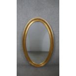A large 20th century gilt framed wall mirror with beaded detailing. H.126 W.75cm
