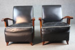 A pair of mid century French Art Deco style beech framed armchairs in piped leather upholstery on