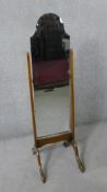 A mid century arched and shaped cheval mirror with bevelled plate. H.148 H.53 D.43cm