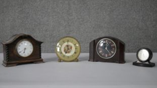 A collection of vintage clocks and gauges. Including an oak cased mantel clock with white enamel