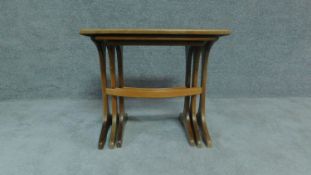 A nest of three oak graduating tables by G-Plan, label to underside. H.52cm W.56cm L.41cm