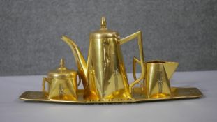 An Arts and Crafts brass German coffee set. The coffee pot stamped to base with makers mark GBN