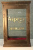 A vintage painted pine table top display cabinet later painted; Asprey Jewellers. H.64 W.38 D.38cm.