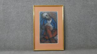 A framed and glazed pastel study of a seated man, indistinctly signed. H.70 W.46cm