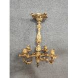 A heavy gilt bronze Rococo style four branch ceiling candelabra with allover scrolling foliate