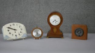 A collection of clocks and barometers. Including an Art Deco ceramic clock, a mahogany inlaid mantle