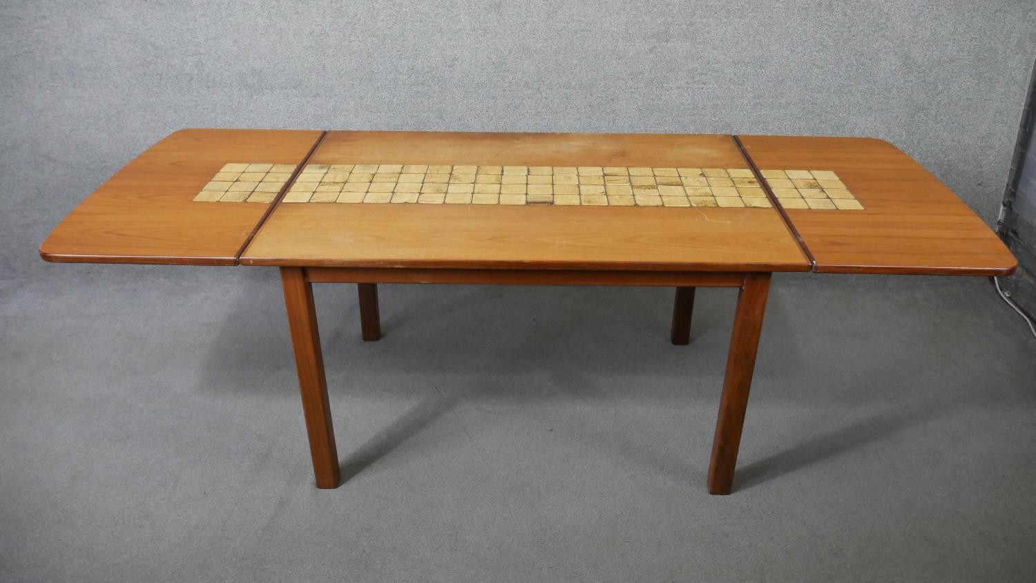 A 1960's vintage teak drop flap dining table with stoneware tile inlaid surface raised on square - Image 3 of 6