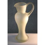 A vintage hand blown frosted clear art glass jug of elongated form. H.39 W.18 D.14cm.