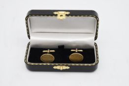 A pair of 9 carat gold plated silver vintage cufflinks with engine turned decoration. Hallmarked: