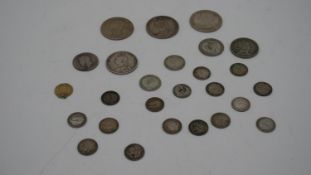 A collection of twenty five 19th and 20th century white metal coins. Including threepences,