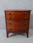 A Georgian mahogany bow fronted commode on swept supports. H.70 W.60 D.40cm