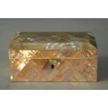 A red fabric lined mother of pearl mosaic trinket box. (no key) H.6 W.14 D.8cm.