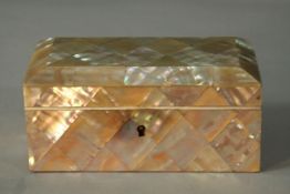 A red fabric lined mother of pearl mosaic trinket box. (no key) H.6 W.14 D.8cm.