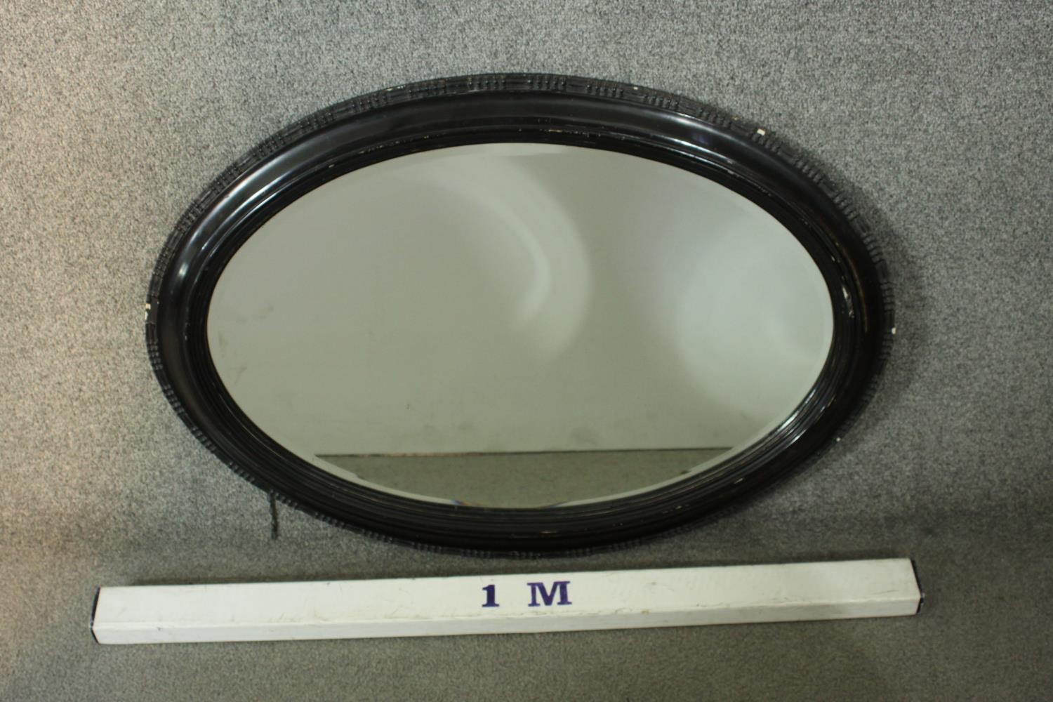 A Victorian ebonised framed oval wall mirror. H.87 W.61cm. - Image 3 of 3