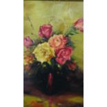 A gilt framed oil on board of a vase of roses. Signed Stan Butler. H.47 W.39cm