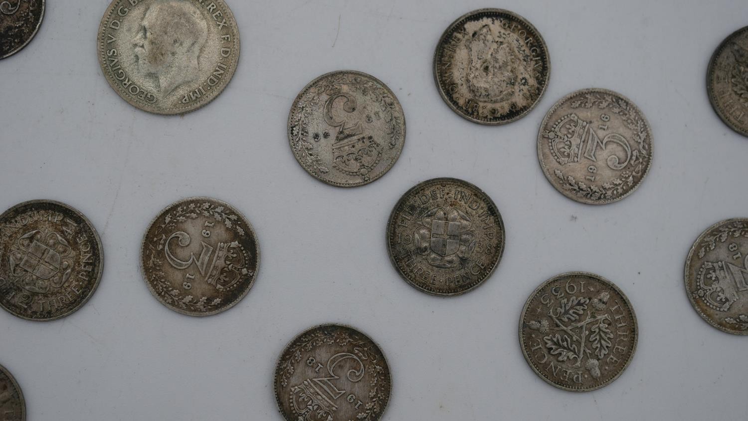 A collection of twenty five 19th and 20th century white metal coins. Including threepences, - Image 12 of 12