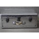 A vintage polished aluminium aviation trunk. With iron fittings, studded detailing and canvas