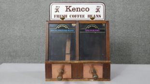 A vintage Kenco coffee dispenser with metal scoops with wooden handles, labels to front. H.48 W.38