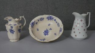A Victorian blue and white floral design washbowl and jug, makers mark to the base along with rose