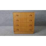 A mid century vintage light oak chest of drawers on plinth base. H.82 W.76 D.46cm