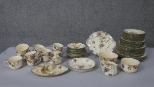 A Royal Doulton 'Kew' pattern twelve person part dinner service. Printed and hand painted with a