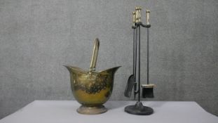 A Victorian brass helmet shaped coal bucket and vintage fire iron set. H.76 Diam.23cm (largest)