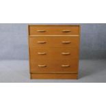 A mid century vintage light oak G-Plan chest of drawers with maker's stamp to the back. H.85 W.76