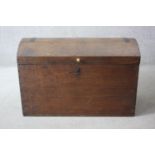 A 19th century ash metal bound domed top travelling trunk with twin carrying handles. H.63 W.94 D.43