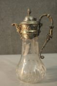 An Edwardian silver plate and etched glass claret jug. The glass decorated with stylised foliate and