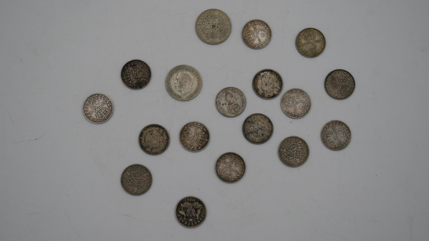 A collection of twenty five 19th and 20th century white metal coins. Including threepences, - Image 10 of 12