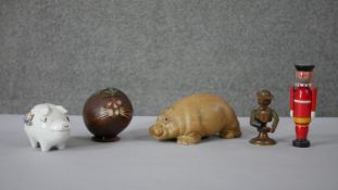 A collection of money banks. Including a Thellwell pony money box, a coconut animal moneybox, two