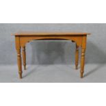 A 19th century pine console table with shaped frieze on turned tapering supports. H.73 W.117 D.53