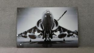 A large black and white photo on glass of a Harrier jump jet. H.08 W.120cm
