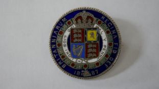 A Victorian silver and enamel half crown coin brooch, dated 1887. Diam.3cm
