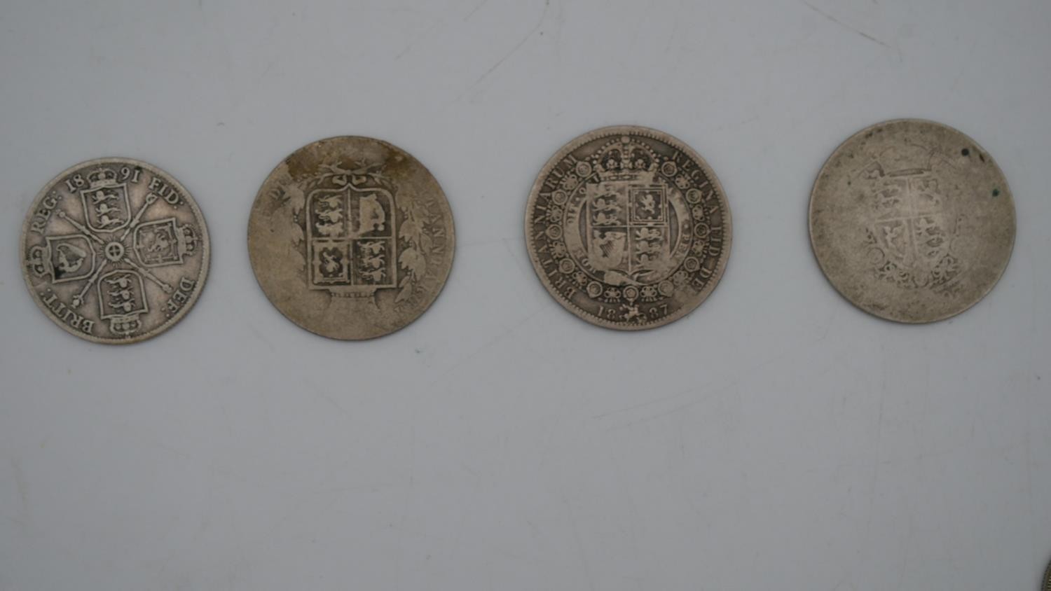A collection of twenty five 19th and 20th century white metal coins. Including threepences, - Image 3 of 12