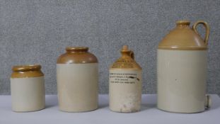 Four 19th century stoneware flagons and jars. One printed Heywood & Co with inscription and