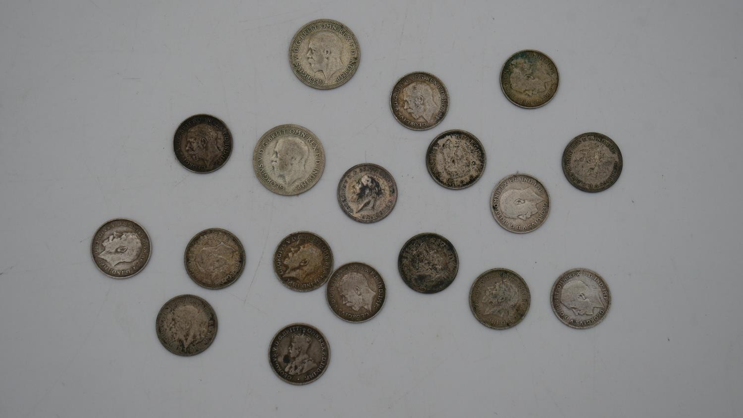 A collection of twenty five 19th and 20th century white metal coins. Including threepences, - Image 9 of 12