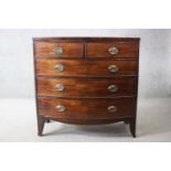 A Georgian mahogany bow fronted chest of drawers on swept bracket feet. H.105 W.104 D.50 cm.